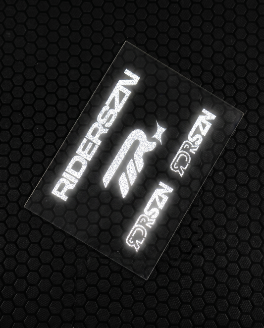 Reflective stickers with 'RIDERSZN' and RDRSZN logo on a textured black background